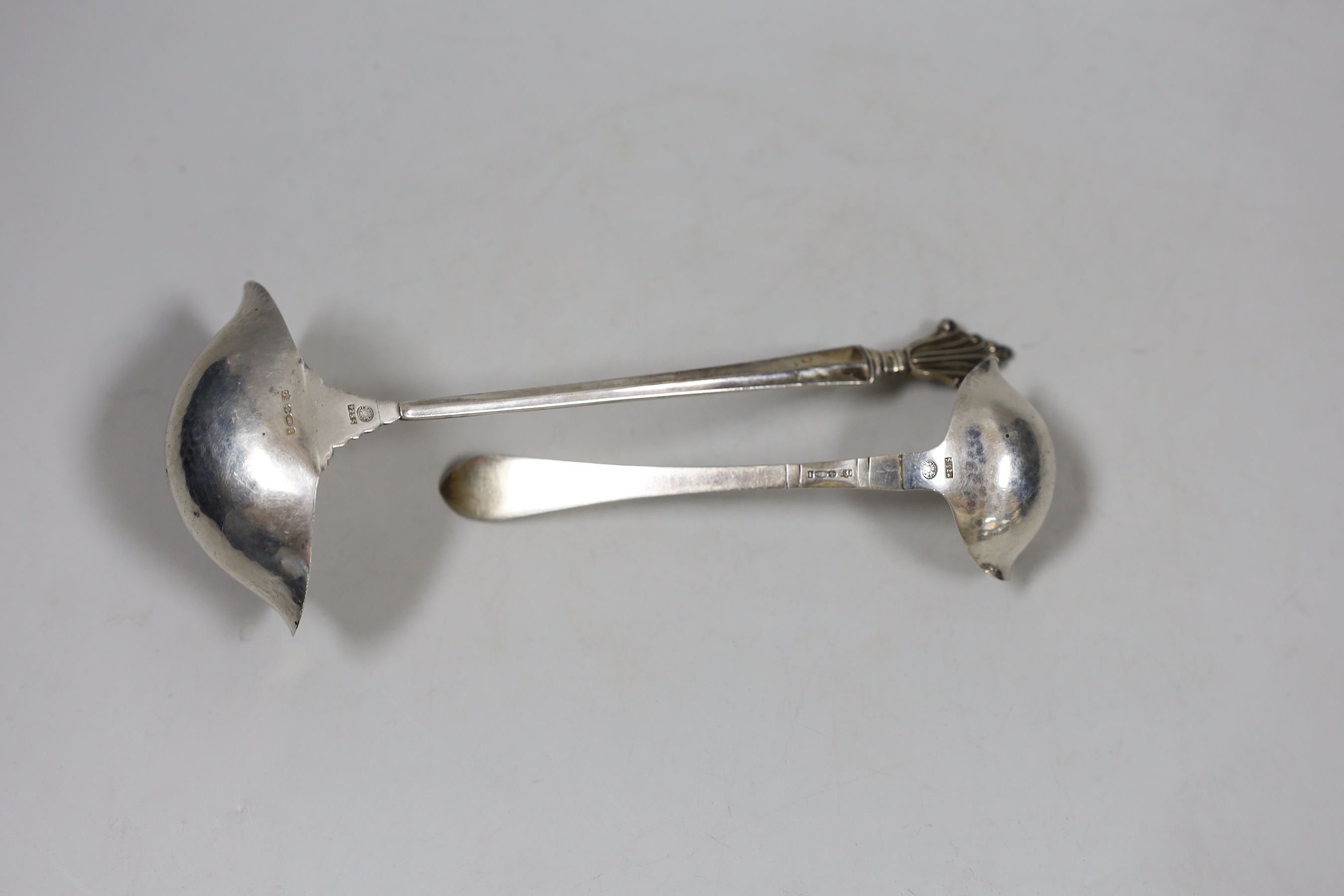 Two Georg Jenson sterling silver ladles, import marks for London, 1926, largest 19cm.